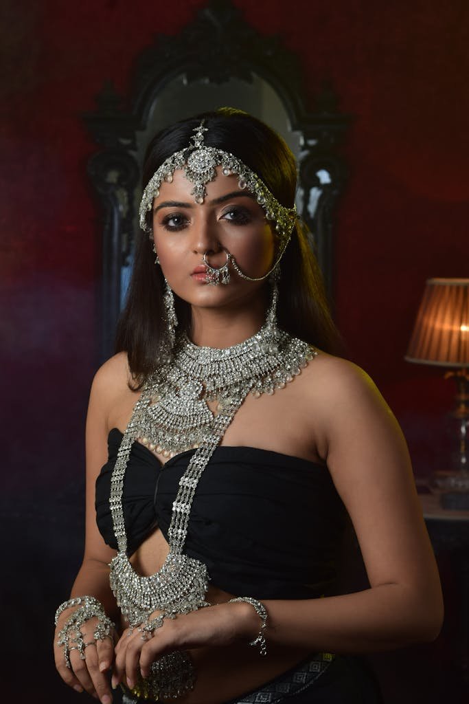 Woman in Black Tube Top Wearing Silver Accessories